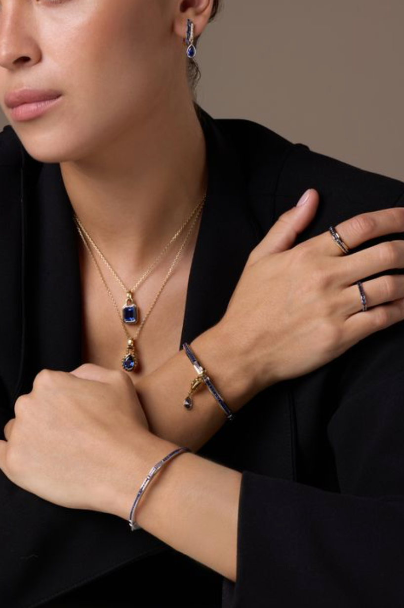 Model wearing DANI sapphire pendants, rings and bracelets – Flower collection