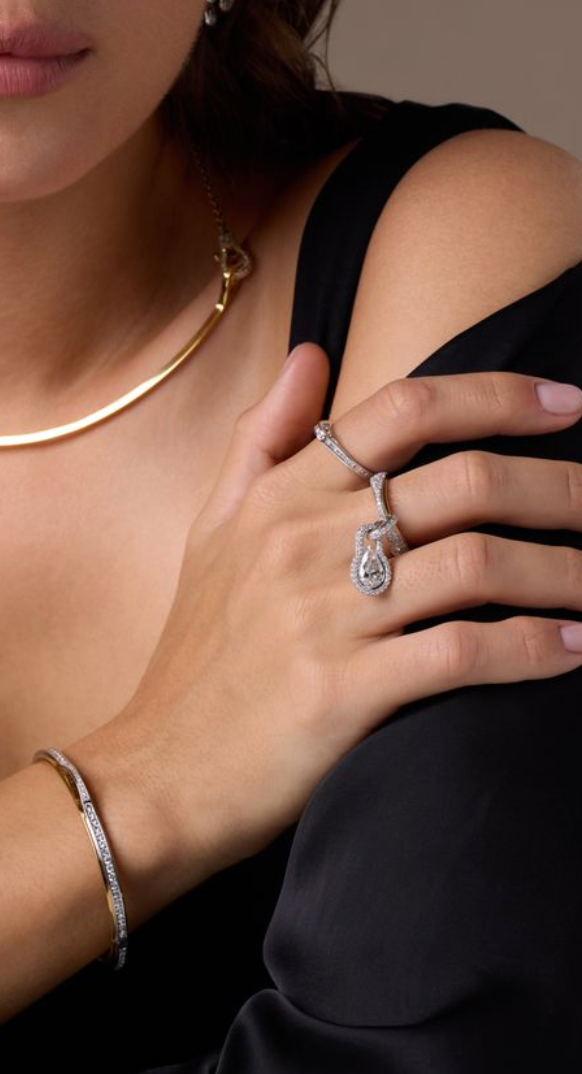 Hand wearing DANI diamond rings and bangle – Uternity collection