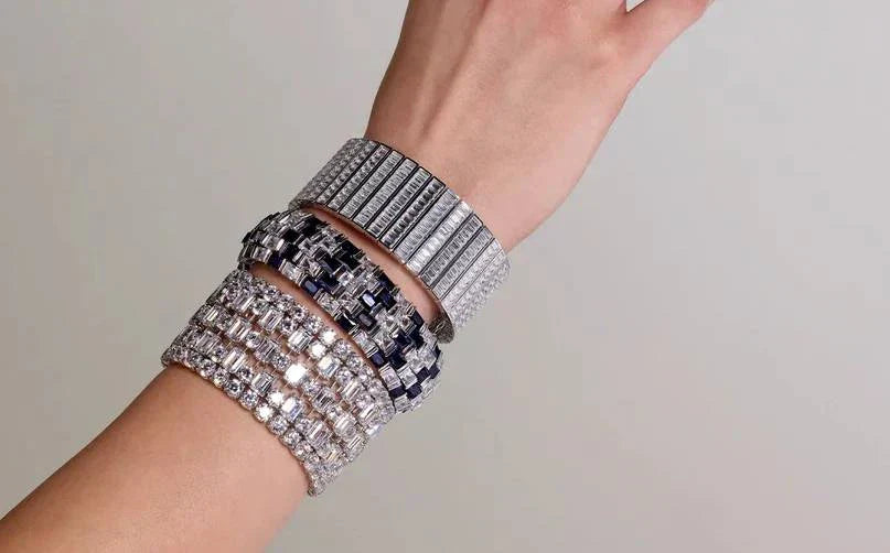 Wrist stacked with DANI diamond bracelets and bangles