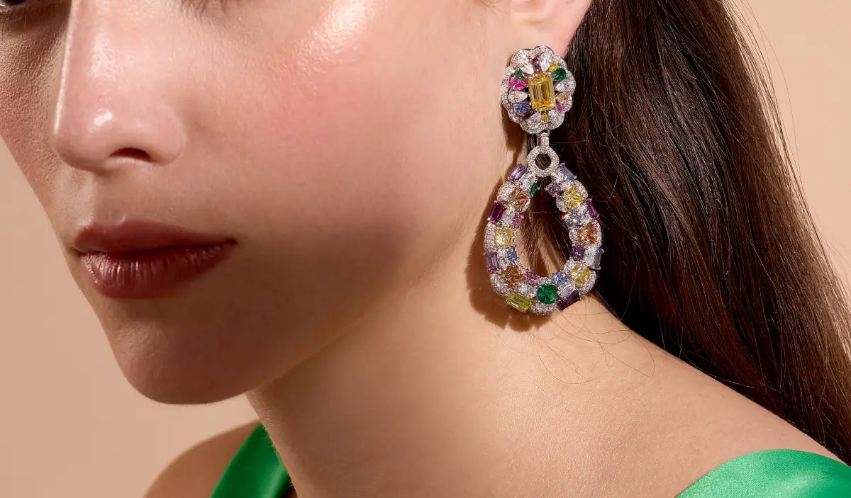 Model wearing DANI multi-gemstone drop earrings
