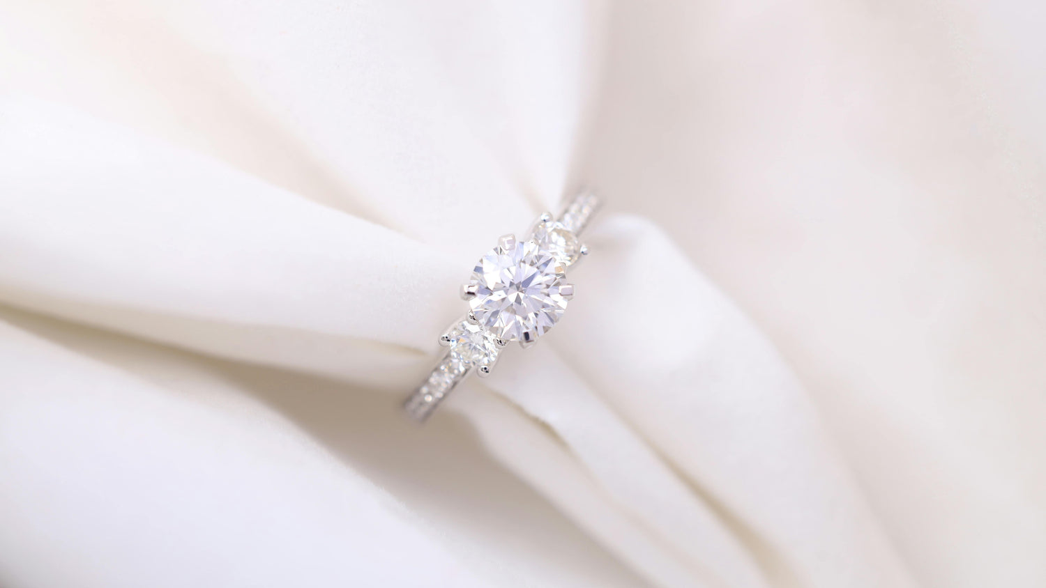 Elegant engagement ring with a sparkling diamond centerpiece, symbolizing love and commitment.