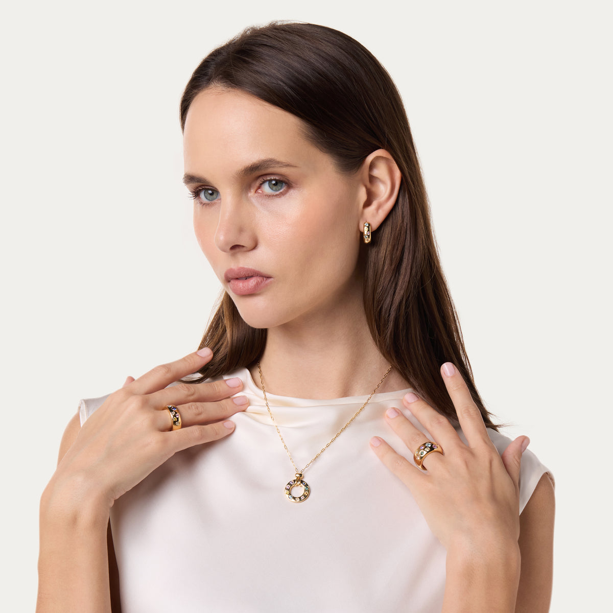 Model wearing a DANI diamond necklace and rings